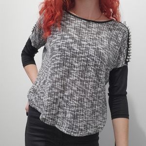 Black speckled faux leather sleeves with spiked shoulder detailing